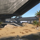 A metal structure looms in the desert on a bluebird day in Halo Infinite.